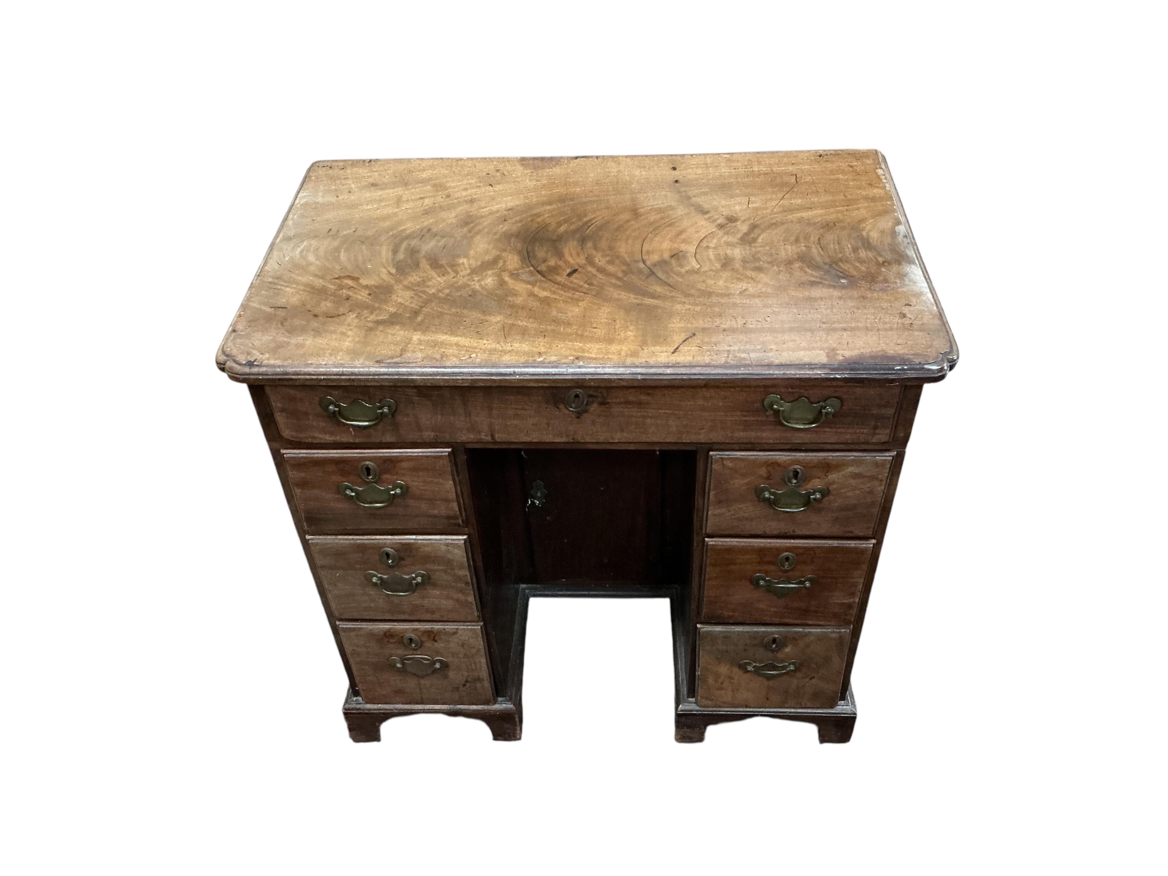 A George II mahogany kneehole desk, width 120cm, depth 48cm, height 75cm